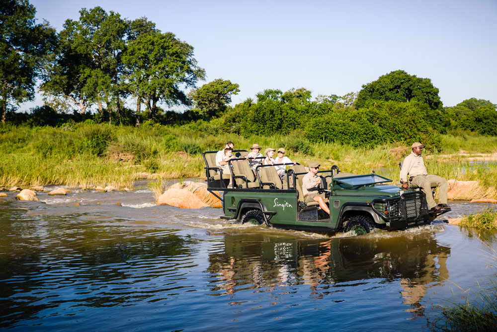 Crossing a river on safari with Wandering Thru.